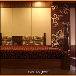 Modern master bedroom bed back Jaali cut from veneer